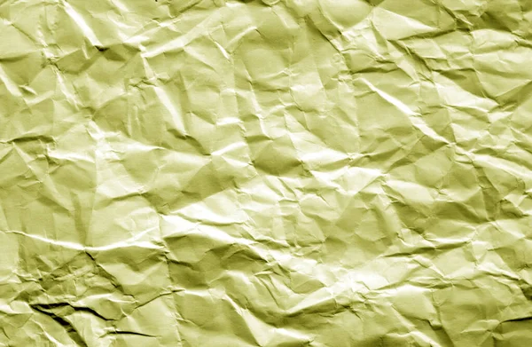 Zerknülltes Blatt Papier mit Unschärfeeffekt in gelber Farbe. — Stockfoto