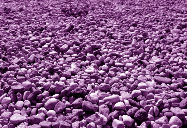 Pile of small gravel stones in purple tone. — Stock Photo, Image