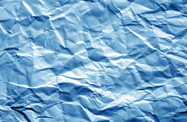 Crumpled sheet of paper with blur effect in navy blue color. — Stock Photo, Image