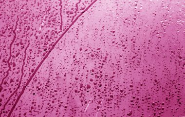 Islak plastik şeffaf eski doku pembe tonda sarın..