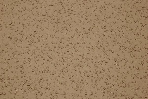 Gotas de agua en la superficie del coche en tono marrón . —  Fotos de Stock