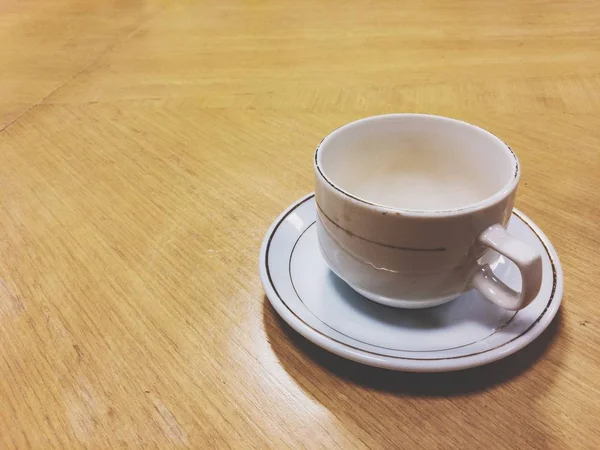 Shot of empty cup. Daily morning ritual, having cup of coffee. Nothing make sense before having a coffee.