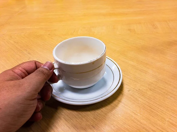 Shot of empty cup. Daily morning ritual, having cup of coffee. Nothing make sense before having a coffee.