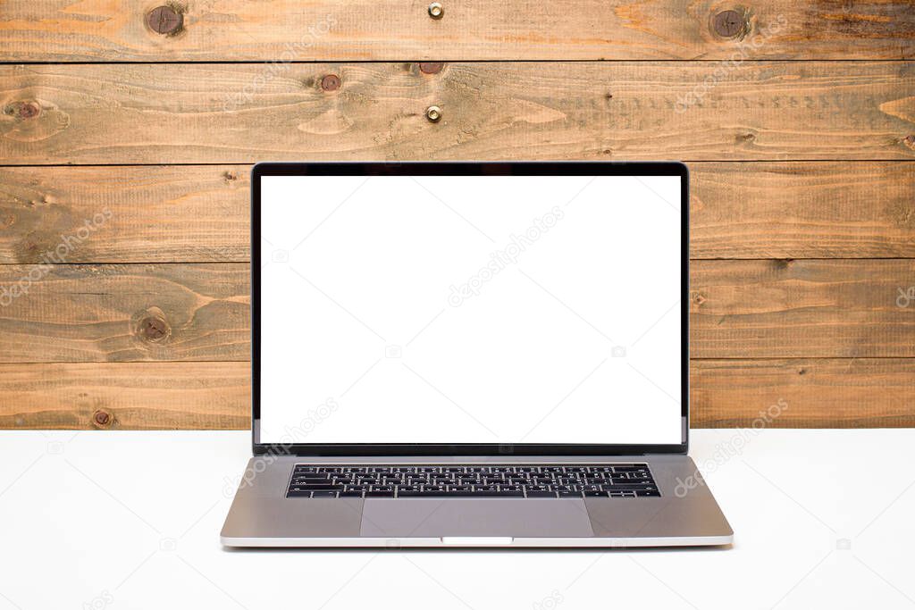Laptop with mockup screen on wooden table,  education concept 