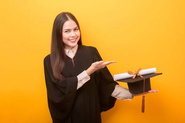 Portrait Happy Beautiful Woman Graduation Gown Holding Education Certificate Yellow — Stock Photo, Image