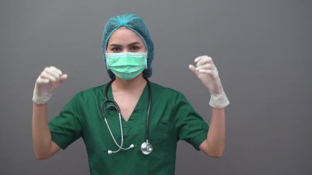 Portrait Young Woman Doctor Uniform Green Scrubs Confident Gray Background — Stock Video