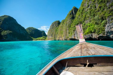 View of thai traditional longtail Boat over clear sea and sky in the sunny day, Phi phi Islands, Thailand clipart