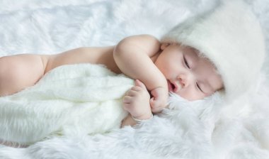 Newborn 30 day old baby boy sleep on  a white wrap cloth feelgood relaxing isolated on white background clipart