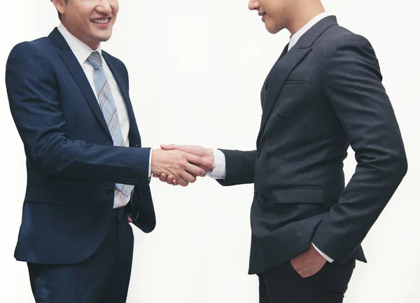 Businessmen making handshake on white - business etiquette, congratulation, merger and acquisition concepts