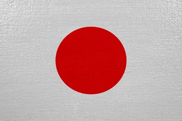 Japan flag on canvas. Patriotic background. National flag of Japan