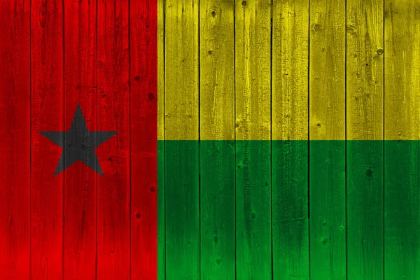 Guinea-Bissau flag painted on old wood plank