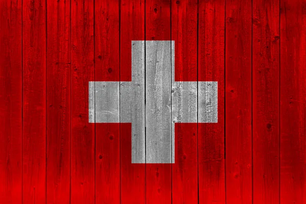 Switzerland flag painted on old wood plank