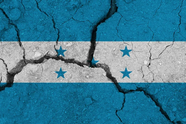 Honduras flag on the cracked earth