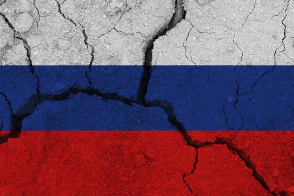 russia flag on the cracked earth
