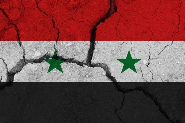 syria flag on the cracked earth
