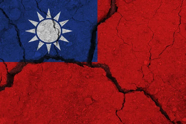 Taiwan flag on the cracked earth