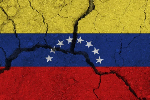 venezuela flag on the cracked earth