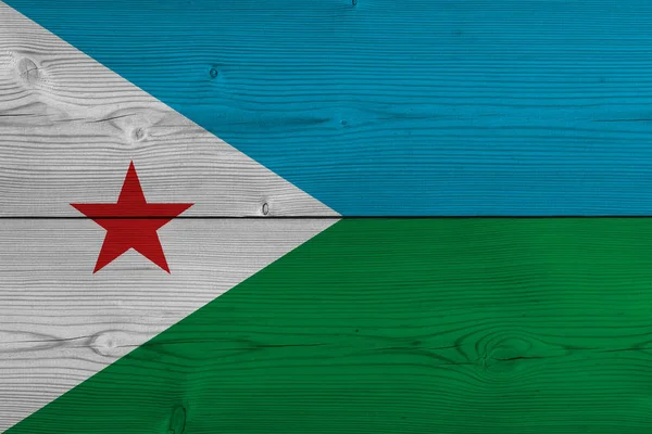 Djibouti flag painted on old wood plank