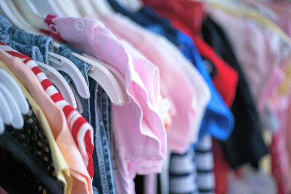 Set of clothes for kids on hangers. Shopping. Royalty Free Stock Images