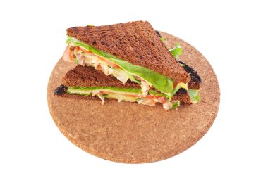 Taze sandviç üzerinde ahşap kurulunda görev yapmaktadır.  