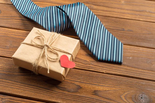 Happy Fathers Day, tie on wooden table