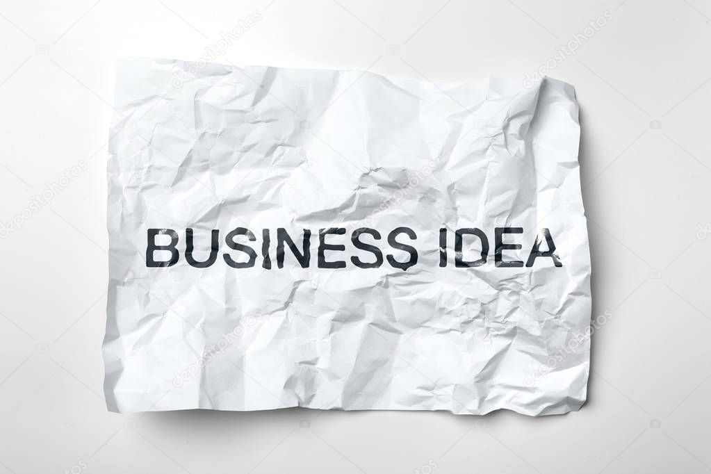 crumple sheet of paper with business idea lettering