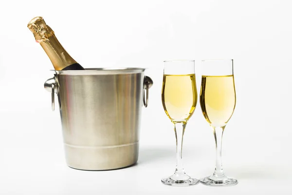 stock image Detail view of champagne bottle and glasses on white background