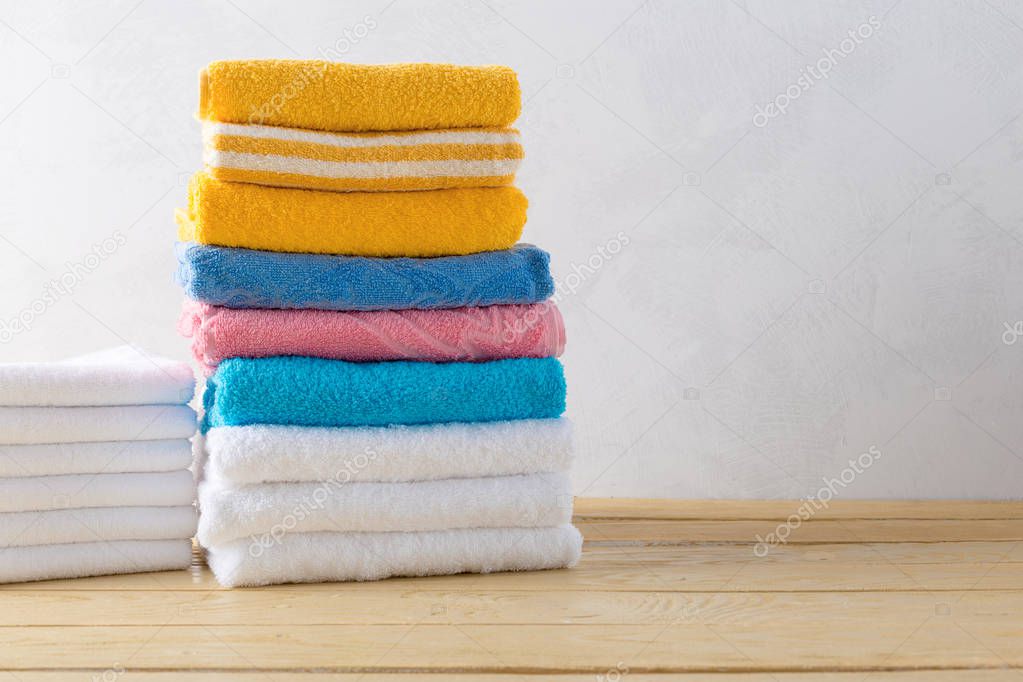 spa towels on wooden surface