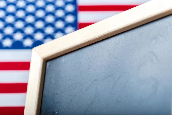 Blank chalk board with American Flag