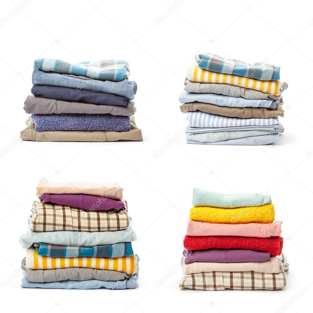 stacks of clothing collection isolated on white background, close-up 