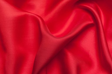 Dalgalı kırmızı kumaş dokulu arka plan olarak 