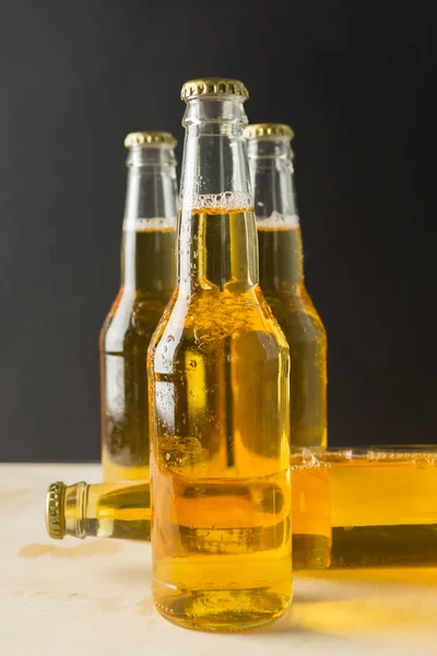 Beer bottles on wooden background