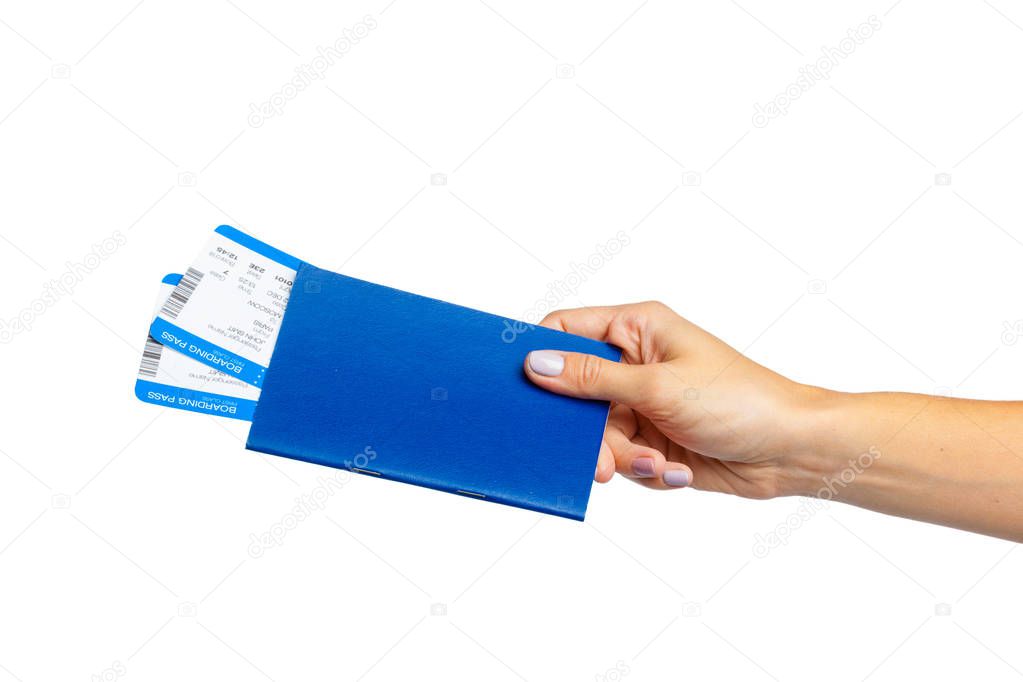 Hand holding passport isolated on white