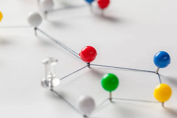 thread connecting red pins, Network  concept, close-up
