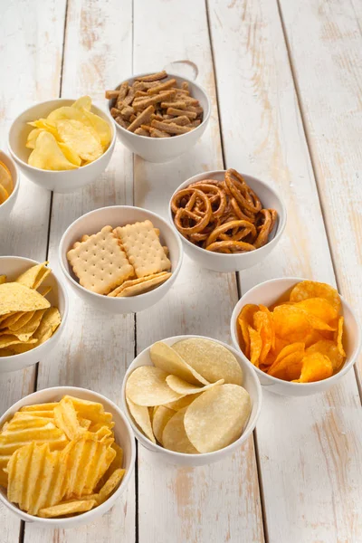 Pretzels Crackers Chips Bowls Wooden Table — Stock Photo, Image