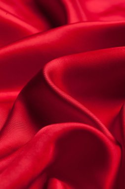 Dalgalı kırmızı kumaş dokulu arka plan olarak 