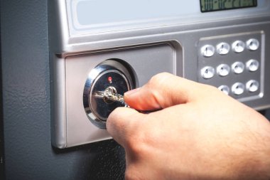hand opening  a safe, close up clipart