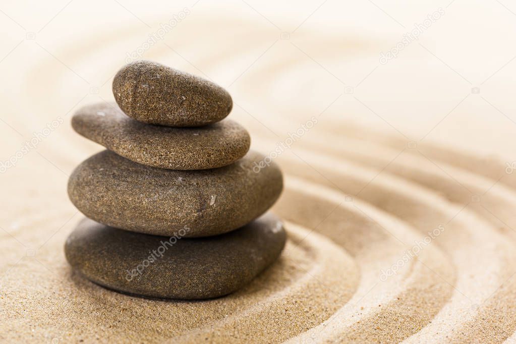 zen garden stones and raked sand 