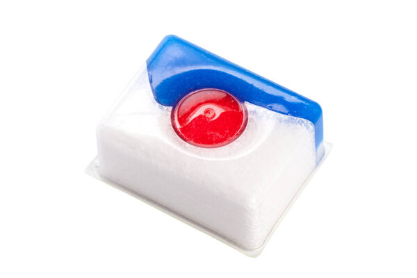 Dishwasher tablet isolated on white background, close-up 