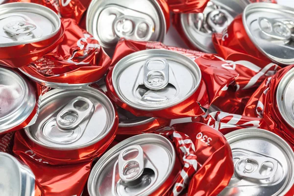Compressed red aluminium cans for recycling