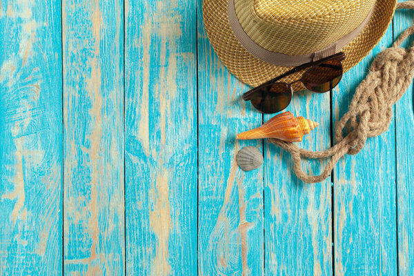 Summer Beach accessories on blue wooden table