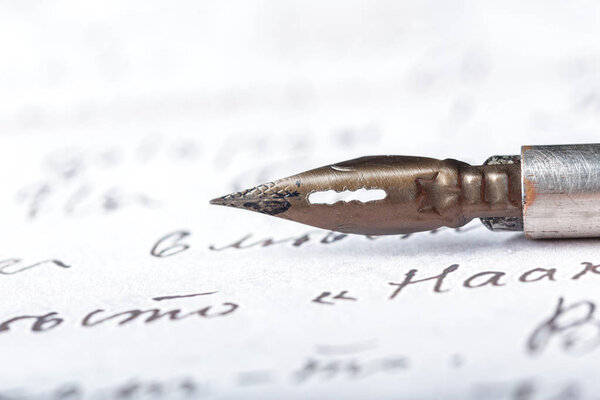 Fountain pen on an antique handwritten letter