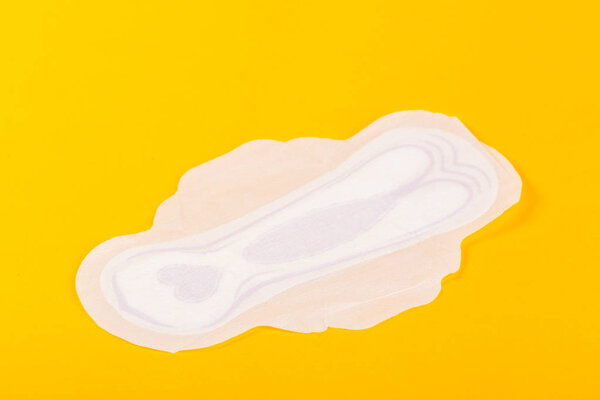 Means of protection for female hygiene on yellow background 