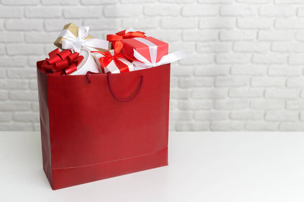 Gift box in paper shopping bag