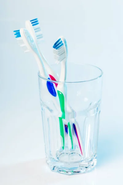 Toothbrushes Glass Table Light Background — Stock Photo, Image