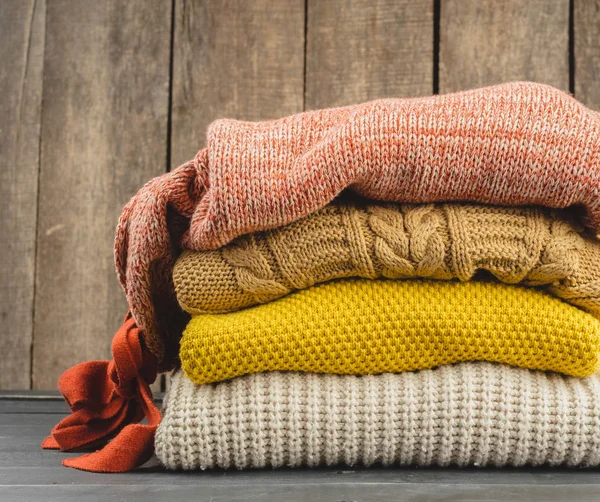 Stack of cozy knitted sweaters