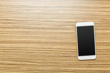 Ofis masaları ile smartphone üstünde o. Yukarıdan görüntülemek 