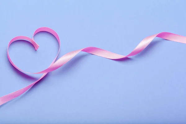 ribbon HIV, AIDS on blue background - Stock Image - Everypixel