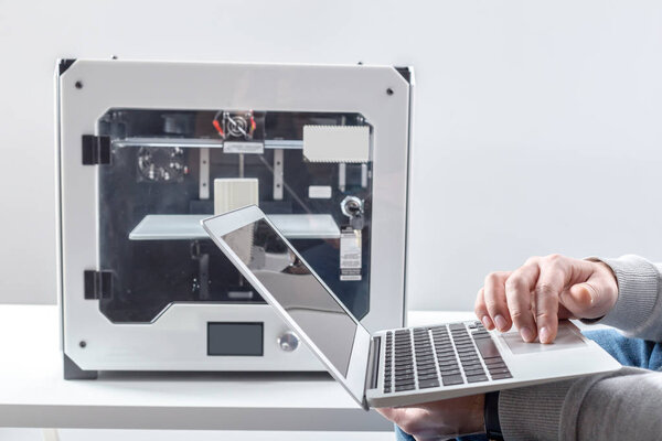 close-up view of designer Working With 3D Printer