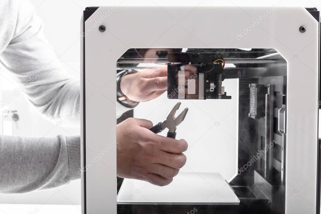 close-up view of designer Working With 3D Printer